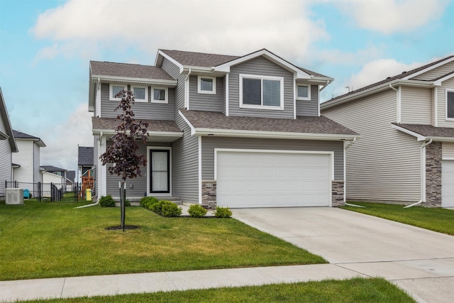 610 NE Whitetail Dr, Ankeny, IA 50021 - view of front of home with an attached garage, roof with shingles, driveway, and stone siding