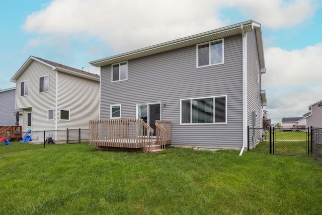 610 NE Whitetail Dr, Ankeny, IA 50021 - back of property featuring a wooden deck, a fenced backyard, and a gate