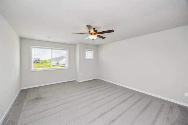 610 NE Whitetail Dr, Ankeny, IA 50021 - carpeted spare room featuring ceiling fan and baseboards