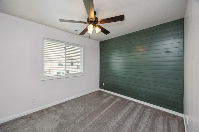 610 NE Whitetail Dr, Ankeny, IA 50021 - empty room featuring dark colored carpet and a ceiling fan