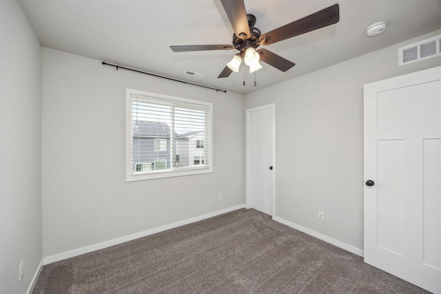 610 NE Whitetail Dr, Ankeny, IA 50021 - unfurnished bedroom featuring dark colored carpet and a ceiling fan