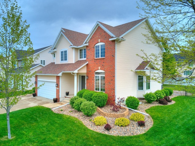 view of front of property with a garage and a front yard