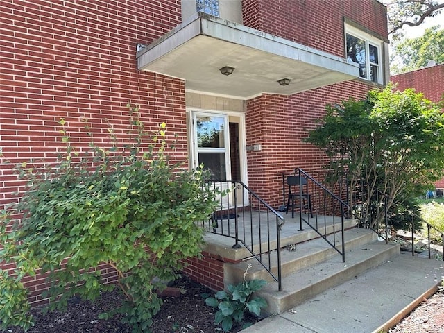 entrance to property with brick siding