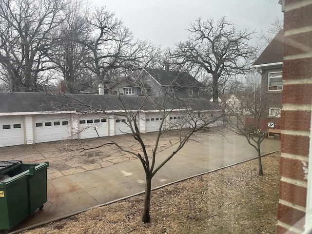 view of side of property with community garages