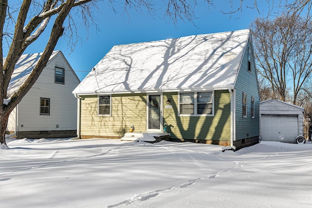 view of front of house with a garage and an outdoor structure