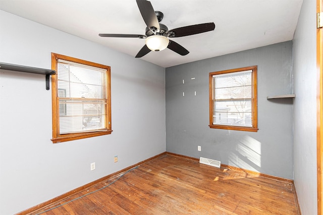 unfurnished room with light hardwood / wood-style floors and ceiling fan