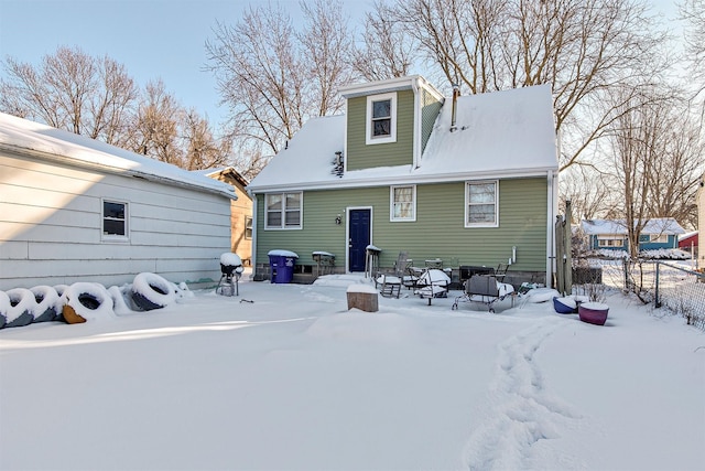 view of snow covered house