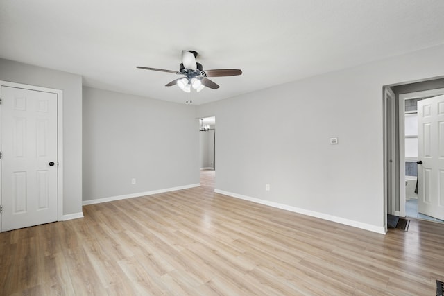 spare room with ceiling fan and light wood-type flooring