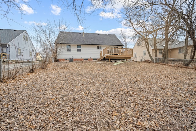 back of house featuring central AC and a deck