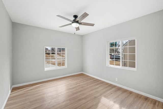 unfurnished room featuring ceiling fan and light wood-type flooring