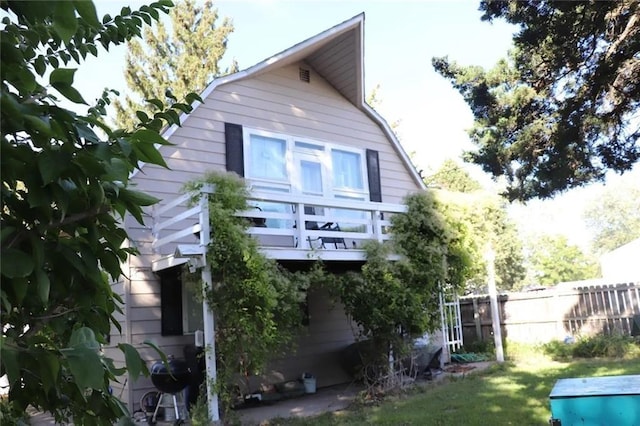 rear view of house with a yard