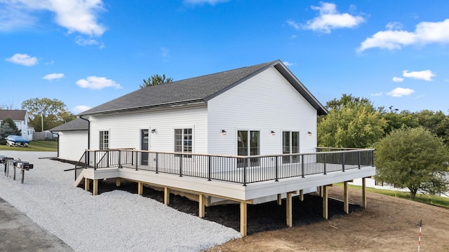 rear view of house featuring a deck