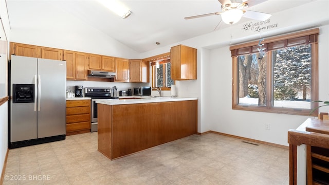 kitchen with sink, high vaulted ceiling, appliances with stainless steel finishes, kitchen peninsula, and ceiling fan