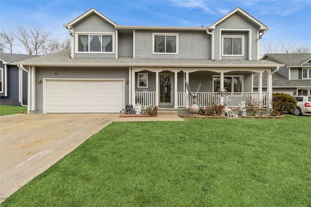 view of front of home with a garage, a front lawn, and covered porch