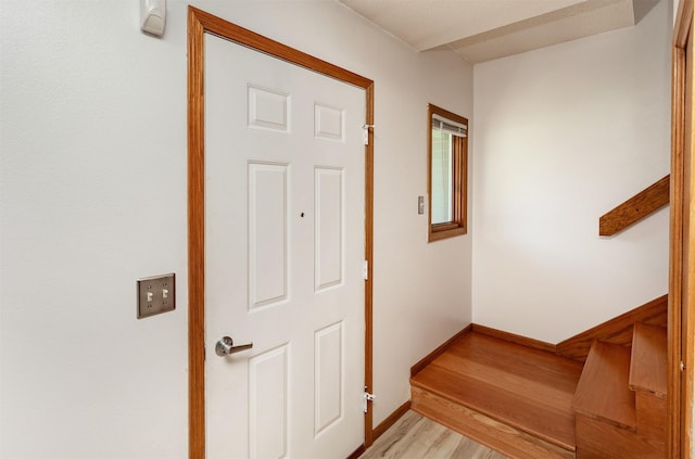 3015 Deerpath Ct, Des Moines, IA 50320 - stairs with wood finished floors and baseboards