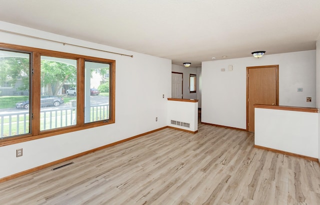 3015 Deerpath Ct, Des Moines, IA 50320 - unfurnished room featuring light wood-style flooring and baseboards