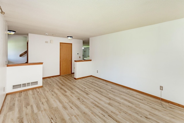 3015 Deerpath Ct, Des Moines, IA 50320 - unfurnished room with wood finished floors and stairway