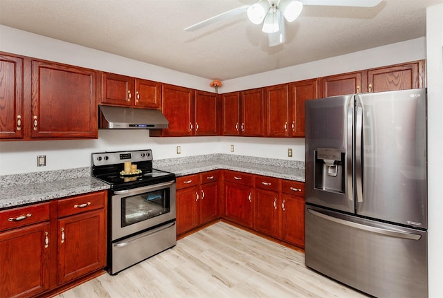3015 Deerpath Ct, Des Moines, IA 50320 - kitchen with stainless steel appliances, under cabinet range hood, light wood-type flooring, and dark brown cabinets