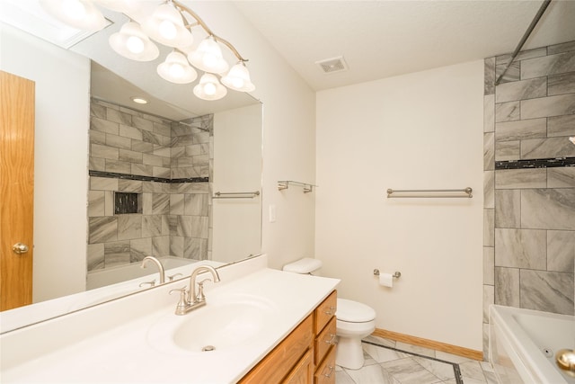 full bathroom featuring vanity, toilet, and tiled shower / bath combo