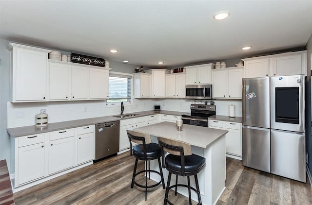 kitchen featuring sink, white cabinets, and appliances with stainless steel finishes