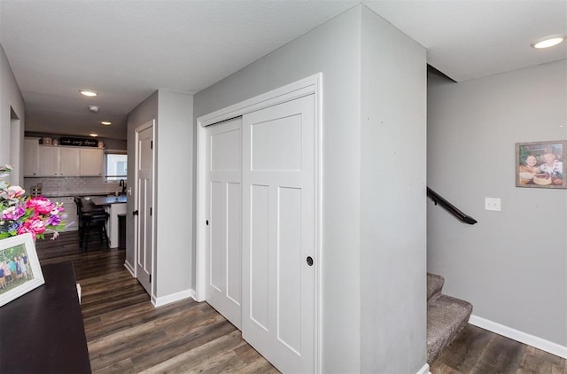 hallway featuring dark wood-type flooring