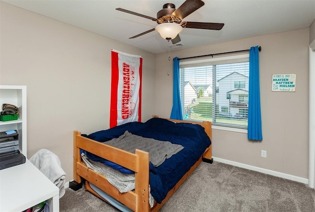 carpeted bedroom featuring ceiling fan