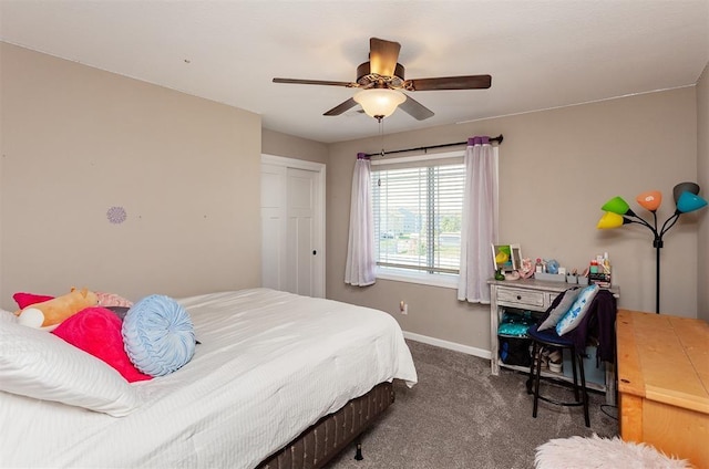 bedroom featuring dark carpet, a closet, and ceiling fan