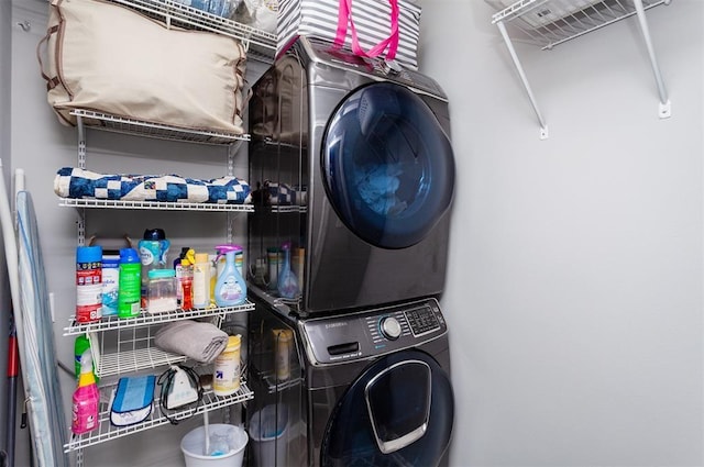 washroom with stacked washer and clothes dryer