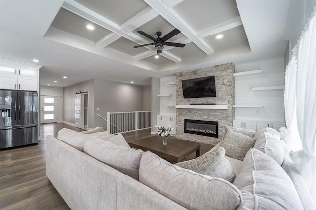 2938 NE Brentwood Cir, Grimes, IA 50111 - living area with coffered ceiling, a ceiling fan, dark wood-type flooring, beamed ceiling, and a fireplace