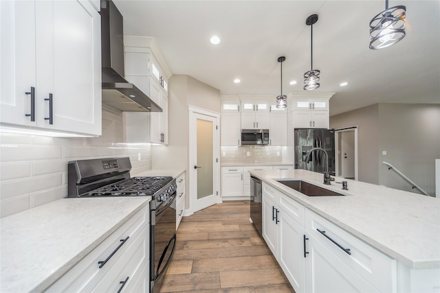 2938 NE Brentwood Cir, Grimes, IA 50111 - kitchen with stainless steel appliances, wall chimney exhaust hood, wood finished floors, backsplash, and recessed lighting