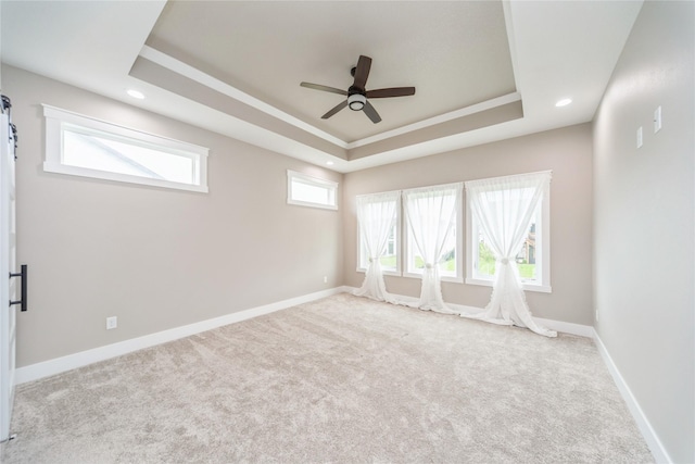 2938 NE Brentwood Cir, Grimes, IA 50111 - spare room featuring ceiling fan, a raised ceiling, carpet, and recessed lighting