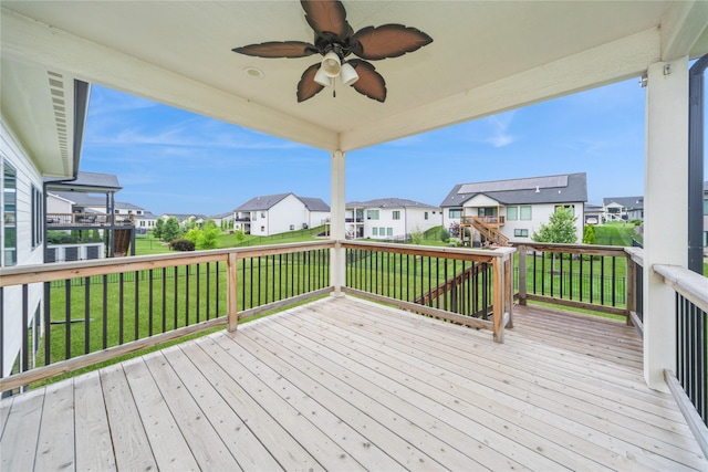 2938 NE Brentwood Cir, Grimes, IA 50111 - deck featuring a residential view, a ceiling fan, and a yard