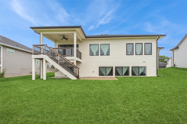 2938 NE Brentwood Cir, Grimes, IA 50111 - rear view of property featuring a ceiling fan, a lawn, and stairway