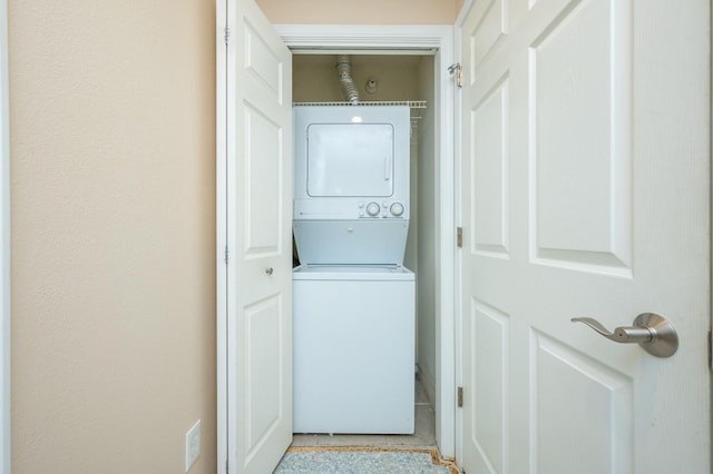 laundry room featuring stacked washing maching and dryer