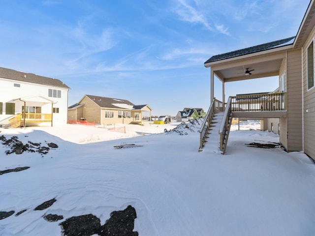 yard layered in snow with ceiling fan