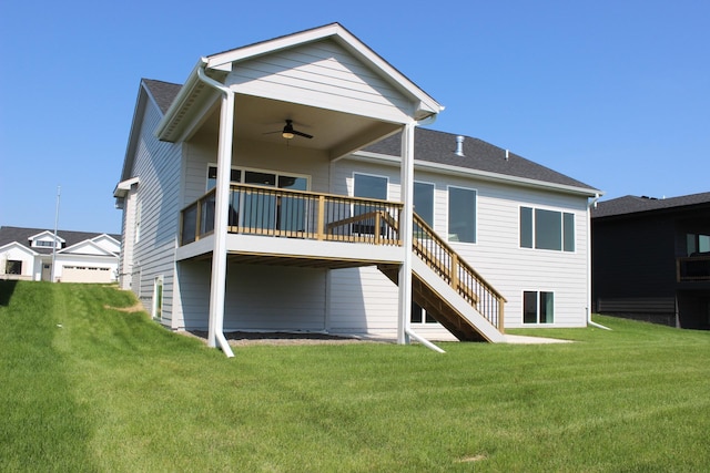 4651 180th St, Urbandale, IA 50323 - back of property featuring a ceiling fan, a lawn, a wooden deck, and stairs