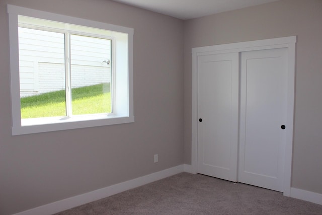 4651 180th St, Urbandale, IA 50323 - unfurnished bedroom featuring carpet flooring and a closet