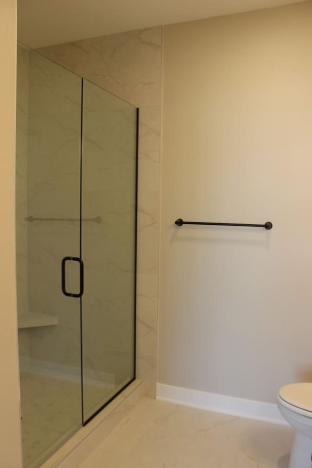 4651 180th St, Urbandale, IA 50323 - full bathroom with marble finish flooring and a marble finish shower