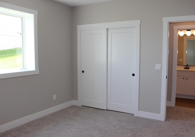 4651 180th St, Urbandale, IA 50323 - unfurnished bedroom with light carpet and a closet