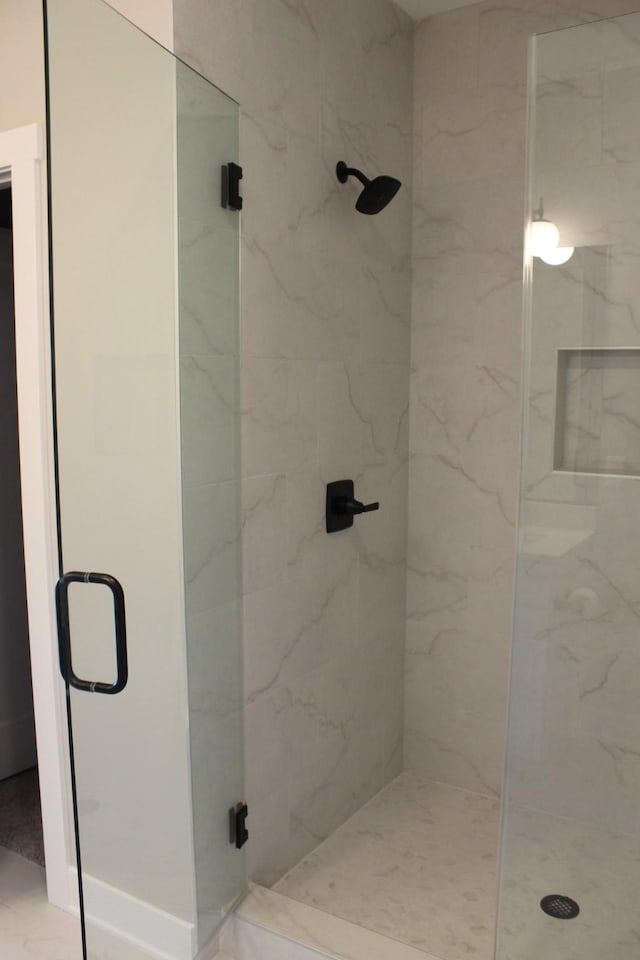 4651 180th St, Urbandale, IA 50323 - bathroom featuring a marble finish shower