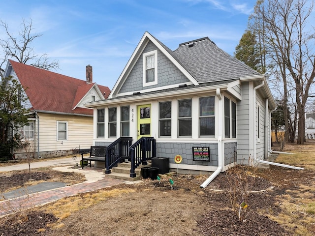 bungalow-style house with a shingled roof