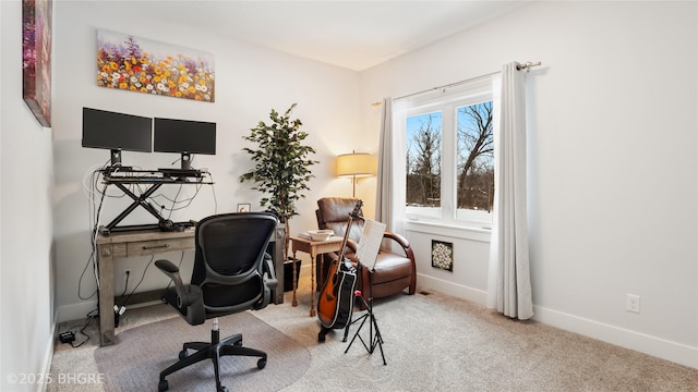 home office with carpet floors and baseboards