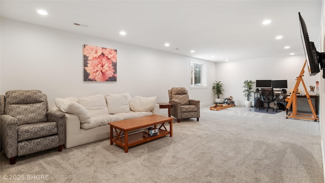 living room with recessed lighting, light carpet, visible vents, and baseboards