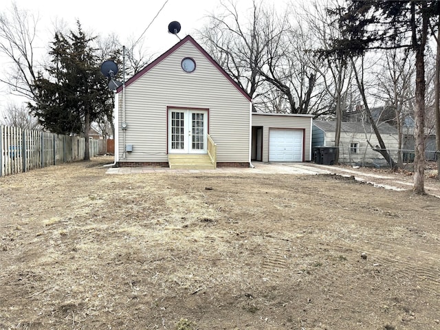 exterior space featuring a garage and an outdoor structure