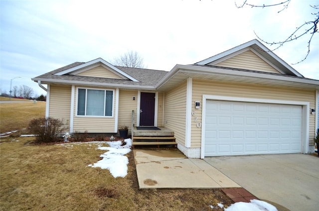 single story home with a garage, concrete driveway, roof with shingles, and a front yard