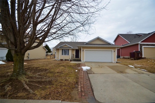 single story home featuring a garage and concrete driveway