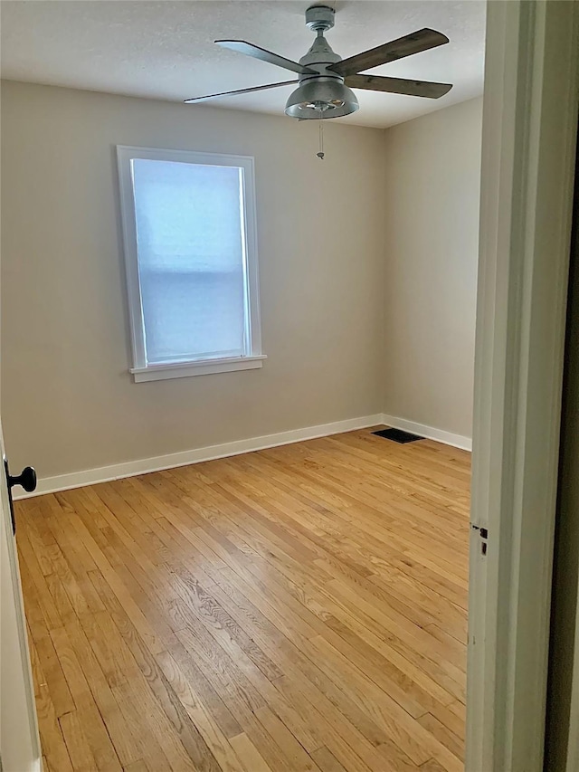 unfurnished room featuring ceiling fan and light hardwood / wood-style floors