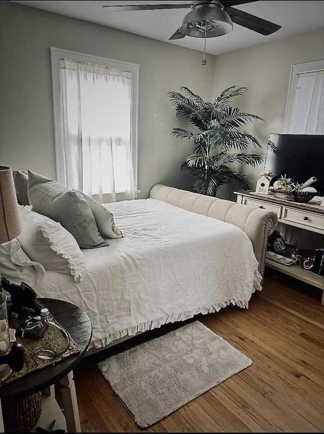 bedroom featuring hardwood / wood-style flooring and ceiling fan