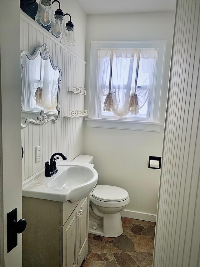 bathroom featuring toilet and vanity