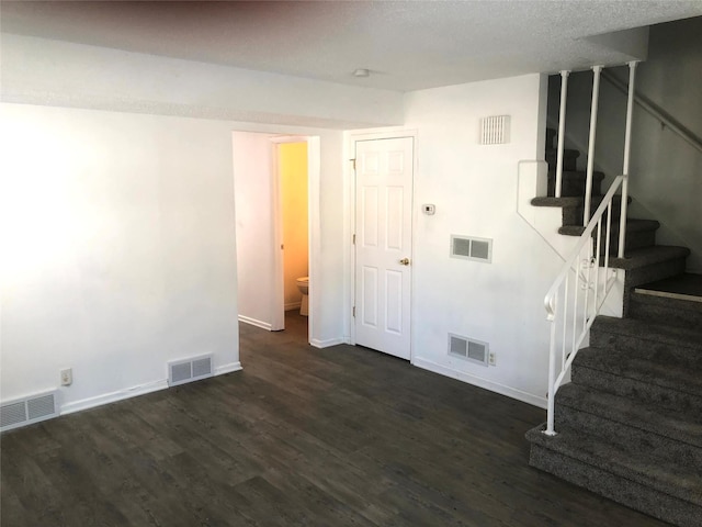 interior space with dark hardwood / wood-style floors